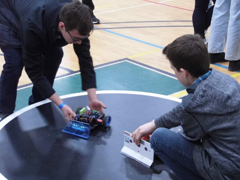 Two sumo robots are placed on the sumo ring.
